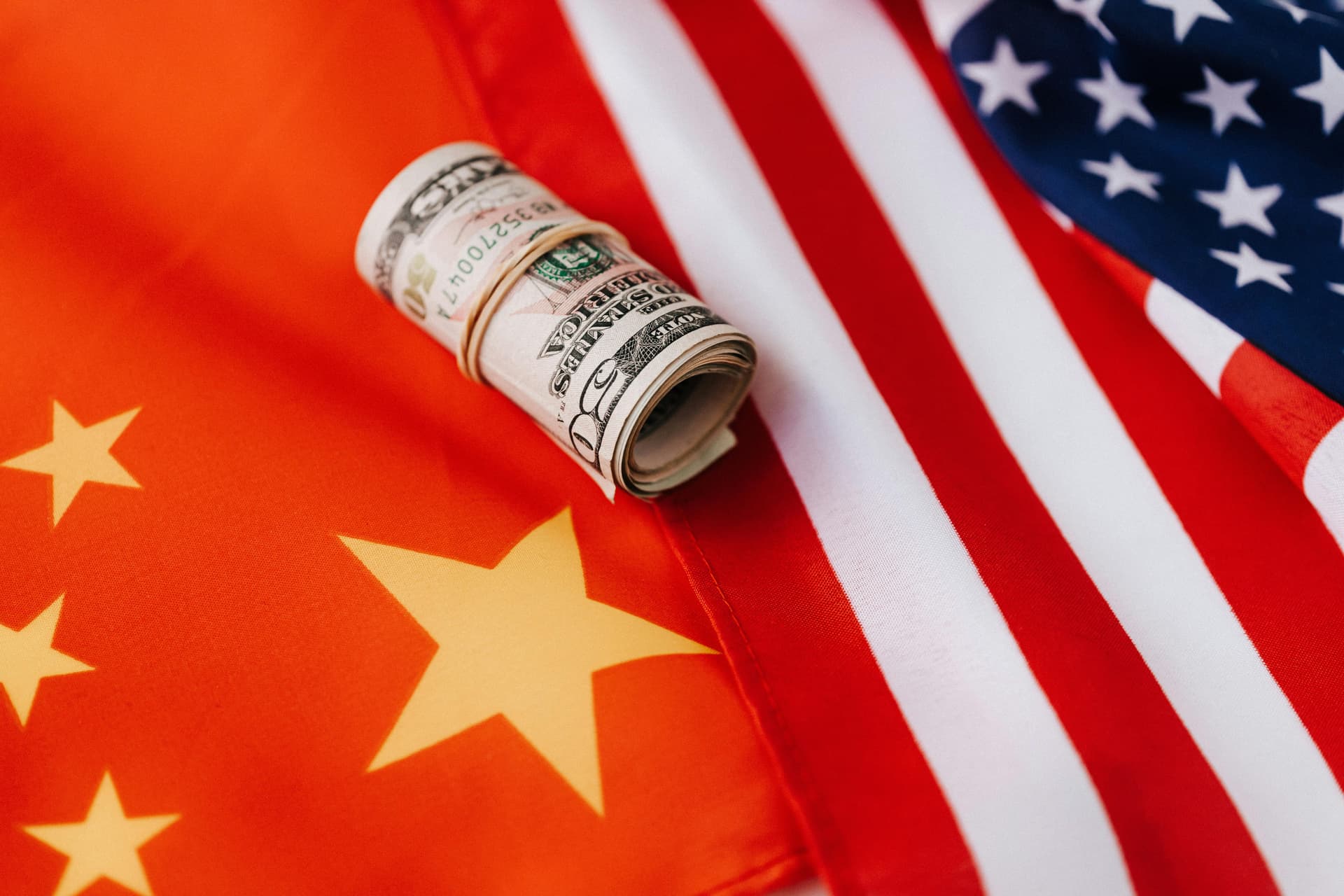 Chinese Flag and USA Flag with money on top