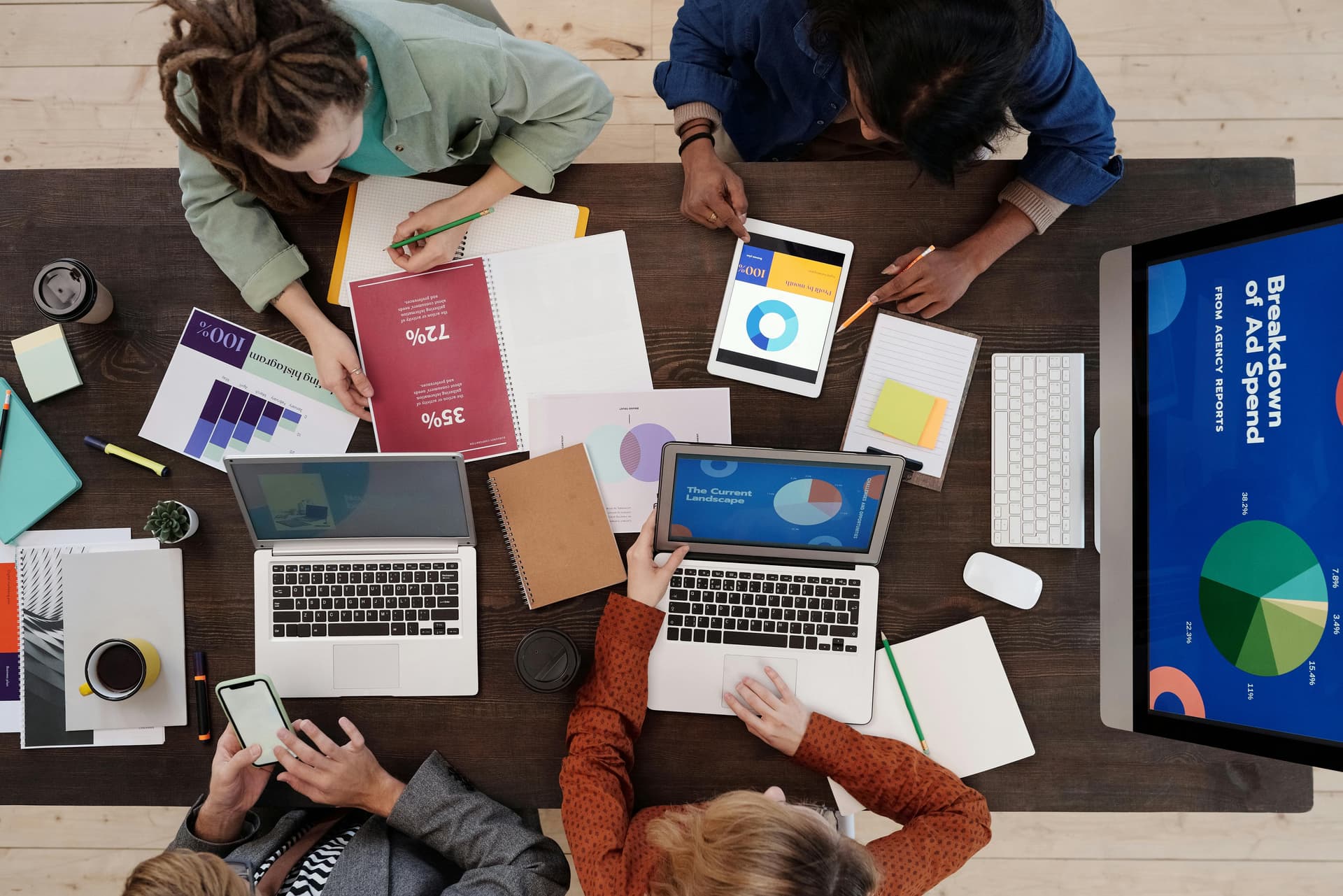 Team members sitting at a desk working.